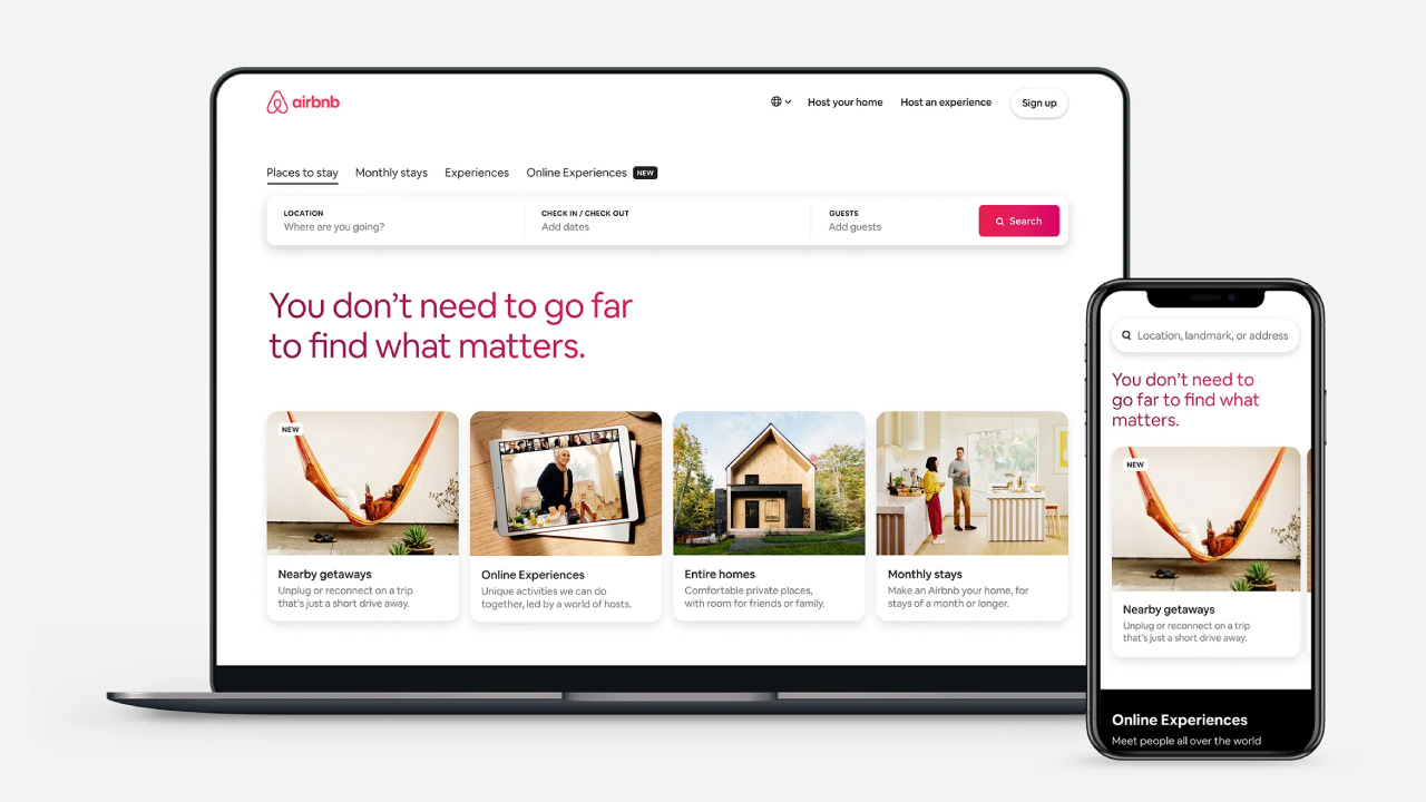 A laptop and a mobile device showcasing the Airbnb website