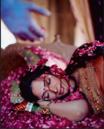 Torani campaign visual featuring a woman in traditional attire surrounded by rose petals.