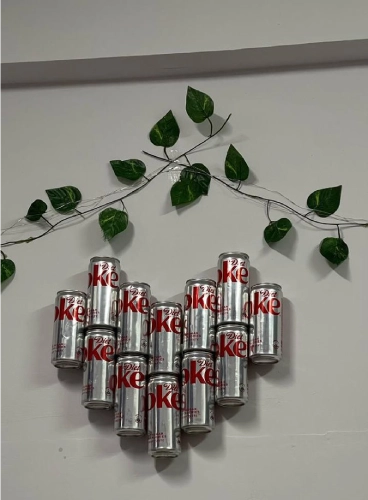 A wall decoration made using Diet Coke cans 