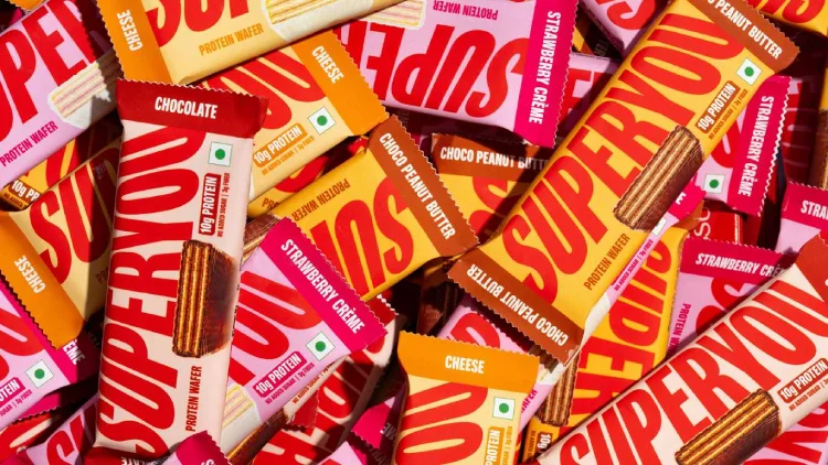  Assorted SuperYou protein wafer bars in bright red and yellow packaging displayed together. 