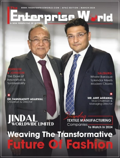 Magazine cover of The Enterprise World featuring two suited business leaders, Dr. Yamunadutt Agarwal and Mr. Amit Agrawal of Jindal Worldwide Limited 