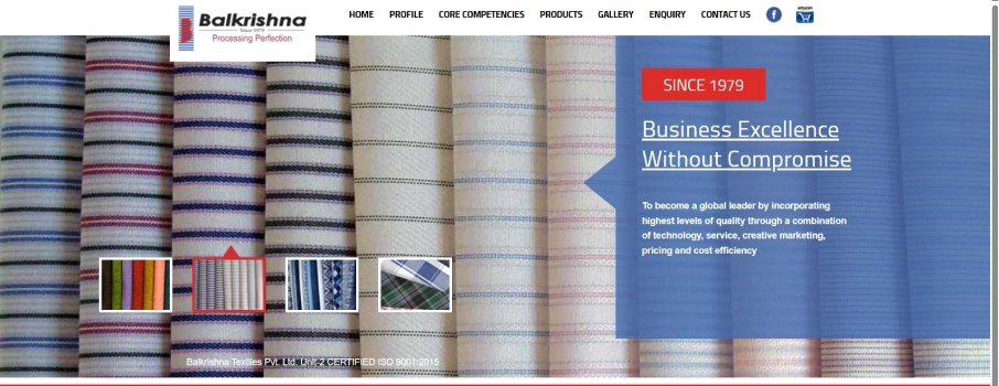 Website homepage banner for Balkrishna Textiles showing striped fabric rolls in the background 