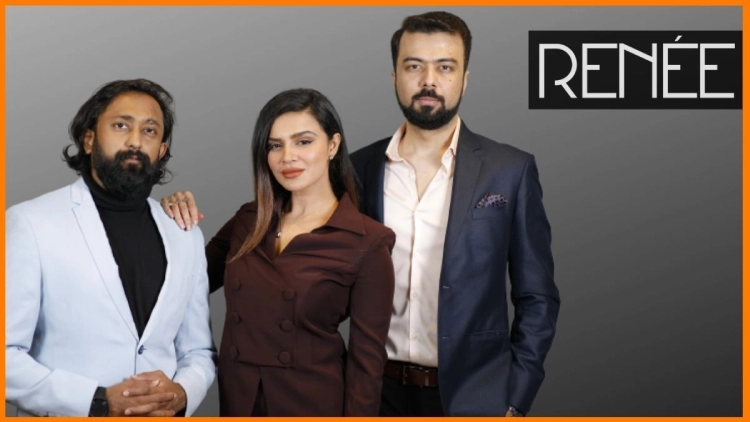 Three RENÉE Cosmetics founders posing in formal outfits