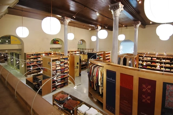 The interior of the Fabindia flagship store showcasing the store layout, furniture, and product displays 